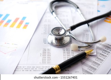 Stethoscope with Pen, Charts and Graphs, Finance, Account, Statistics, Investment, Analytic Research Data Economy Spreadsheet and Business Company Concept