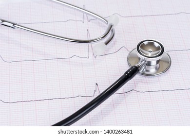 Stethoscope or phonendoscope on the paper electrocardiogram. Medical examination