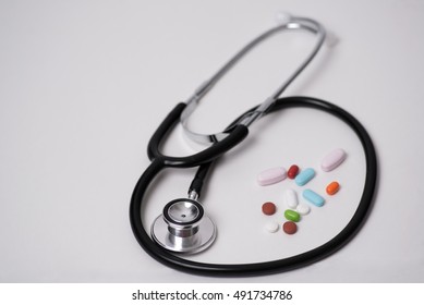 Stethoscope And Pills, Dr. Appointment, Or An Office Visit, For A Patient.