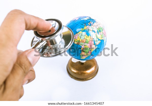 stethoscope with\
plastic globe on white\
background.