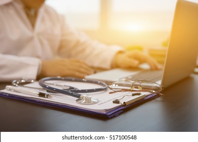 Stethoscope with prescription clipboard and Laptop ,Doctor working an Exam, Healthcare and medical concept,test results in background,vintage color,selective focus - Shutterstock ID 517100548