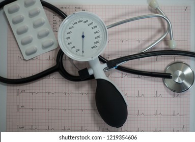 
Stethoscope Resting On An Electrocardiogram Pattern With Pills