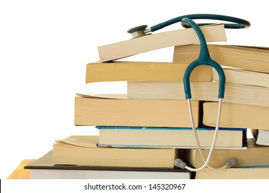 A stethoscope resting on a stack of text books