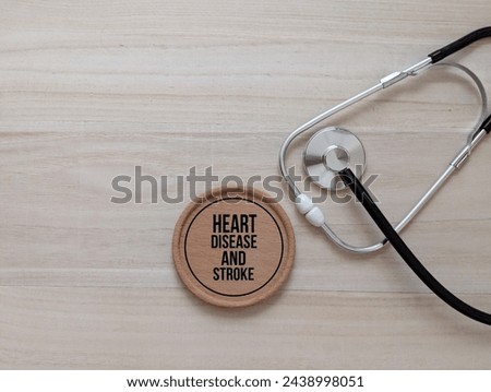 stethoscope and round wooden with the words Heart Disease And Stroke. medical concepts