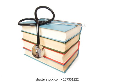 Stethoscope And  Stack Of Books Isolated On White Background. Medical Professional Education And Information Concept.