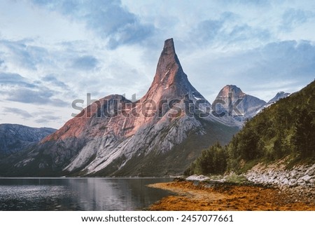 Stetind mountain in Norway sunset landscape scandinavian nature rocky peak and fjord landscape travel beautiful destinations scenery summer season 
