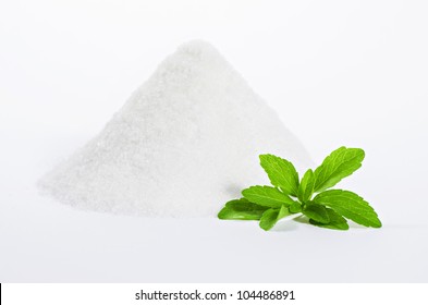 Stevia Leaves With A Pile Of Sugar