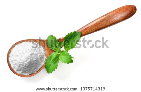stevia sugar powder in the wooden spoon, with fresh stevia leaves, isolated on white background, top view
