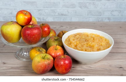 a stewed apples with apples on a wooden table