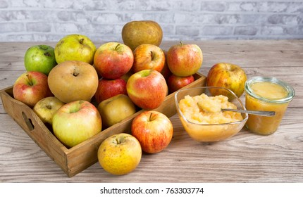 a stewed apples with apples on a wooden table