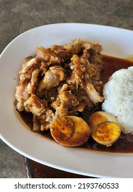 Stewed Leg Pork With Sweet Gravy Sauce On Rice. Pork Knuckle,Chinese Style Food.