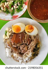 Stewed Leg Pork With Sweet Gravy Sauce On Rice. Pork Knuckle,Chinese Style Food.