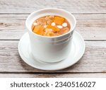 stewed papaya with silver fungus served in dish isolated on wooden table top view hong kong food