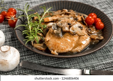 Stewed Pork Chop In A Bright Mushroom Sauce.