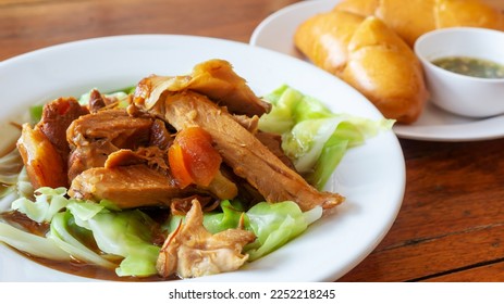 Stewed pork leg with gravy soup with Mantou (Chinese food). - Shutterstock ID 2252218245