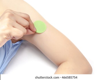 Stick Anti Mosquito Patch On Arm, On White Background Isolated