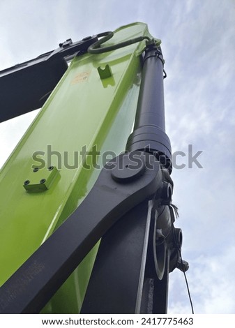 The stick arm linkage of an excavator that is driven by hydraulic cylinder to move the bucket