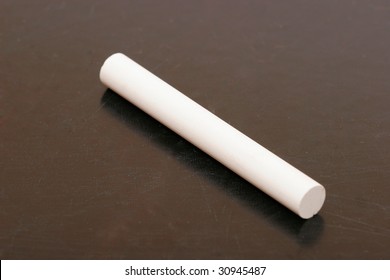 Stick Of Chalk On A Blackboard Isolated Background