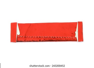 Stick Of Gum Wrapped In Red Shiny Wrapper Isolated On White