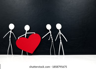 Stick man holding big red heart shape while giving to other people. Share love and kindness, give hope, helping others concept.	 - Shutterstock ID 1858795675