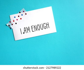 Stick Note On Blue Copy Space Background With Handwritten Text I AM ENOUGH, Positive Mantra Affirmation Self Acceptance, Knowing That You Are Worthy, Valid Loved. Embrace All Flaws And Imperfection