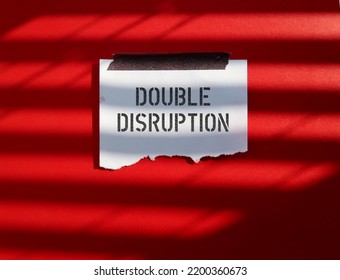 Stick Note On Red Background With Words DOUBLE DISRUPTION, Massive Changes In Companies Operation Due To Covid-19 Pandemic And Increasing Automation That Is Transforming Job Market In All Sectors