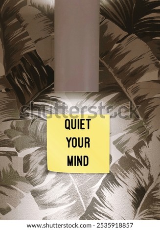 Stick note under lamp with text written Quiet Your Mind - to stop overthinking or repetitive negative thinking - unwanted cognitive activity of rumination and worry
