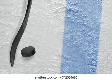 Stick and puck on the ice hockey rink. Concept, hockey, background