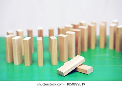 Stick Wood Block Standing On Stacked Square Wood Blocks, Abstract Background Concept Of Winning, Success, Challenge, Step To Top Position.