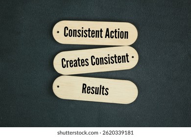 Stick with the words Consistent Action Creates Consistent Results text. Success concept 