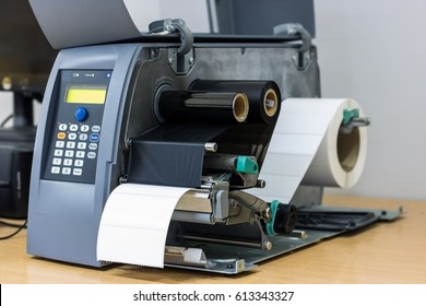 Sticker label printer. Barcode digital printer and applicator machine.