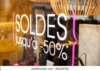 Sticker Sign - Sale Up To Half-price 50% On French Luxury Store Window During Winter Sale Season