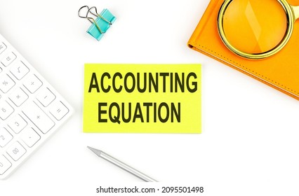 Sticker With The Text ACCOUNTING EQUATION On The White Background, Near Calculator And Notebook