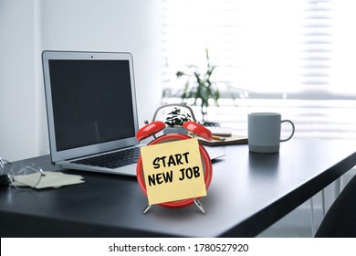 Sticker With Text Start New Job On Alarm Clock Near Laptop In Modern Office