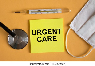 Sticker With Text Urgent Care Lying On The Orange Background With Mask And Thermometer. Medical Concept