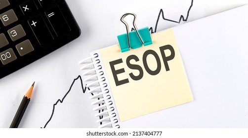 Stickers with pencils and notebook with text ESOP on a chart background