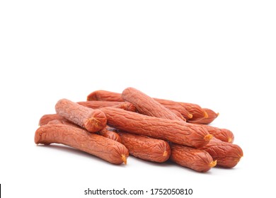 Sticks Of Dried Pepperoni Photographed On A White Background With Ample Copy Space.