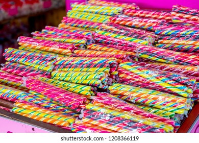Sticks of sugary rock sweets in a seaside shop