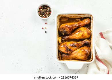 Sticky asian chicken legs in baking dish. Top view, copy space.