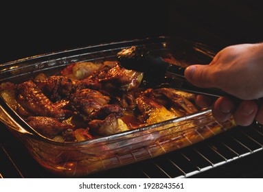 Sticky BBQ Chicken Wings On A Baking Sheet