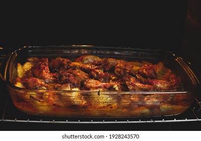 Sticky BBQ Chicken Wings On A Baking Sheet