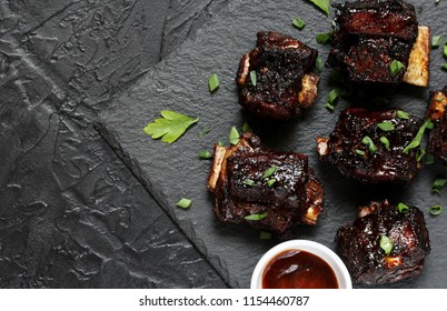 STICKY BEEF SHORT RIBS. Sweet BBQ . Flatlay.  Copy Space. Top View