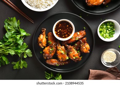 Sticky Honey-soy Chicken Wings On Plate Over Dark Stone Background. Top View, Flat Lay, Close Up