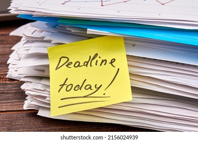 Sticky Note With Deadline Today Writing On The Stack Of Papers. Files And Newspapers.