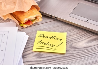 Sticky Note With Deadline Today Writing And Baguette. White Desk Background.