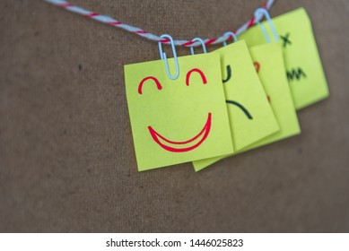 Sticky note with hand drawn a funny smiley face on cork board, with copy space. Positive mood and happy workplace concept. - Shutterstock ID 1446025823