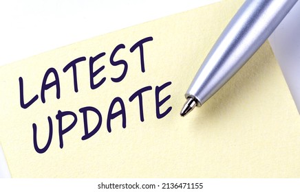 Sticky Note Message LATEST UPDATE with pen on a white background - Shutterstock ID 2136471155