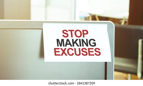 Sticky note on the computer. Text STOP MAKING EXCUSES
