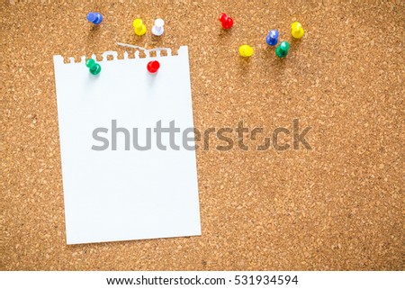 sticky note on cork board, empty space for text