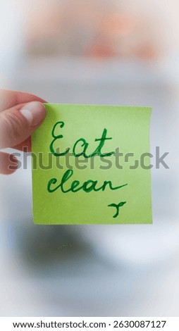 Sticky note reminders on kitchen fridge promoting healthy eating and wellness.